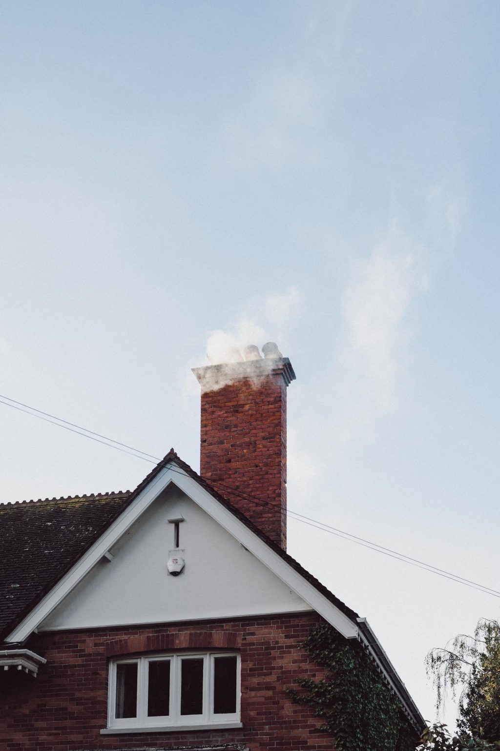 A brick house with a chimney.