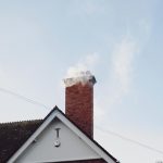 A brick house with a chimney.
